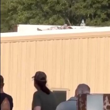 Footage circulating on social media allegedly shows the suspected shooter on a rooftop after being shot.