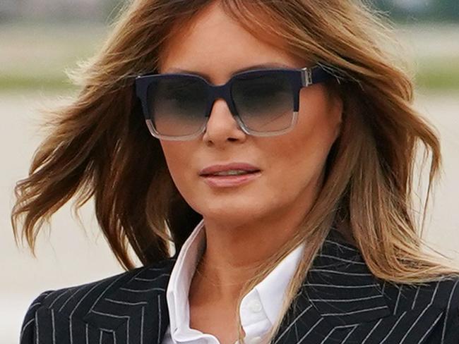 US President Donald Trump and First Lady Melania Trump step off Air Force One upon arrival at Cleveland Hopkins International Airport in Cleveland, Ohio on September 29, 2020. - President Trump announced early on October 2, 2020, that he and First Lady Melania Trump would be going into quarantine after they were both found to have contracted the novel coronavirus. (Photo by MANDEL NGAN / AFP)