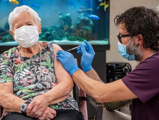 A nursing home resident in her 90s receives the jab at the start of the Swiss COVID-19 vaccination campaign on Wednesday.