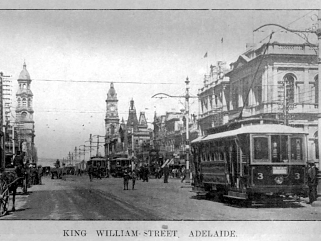 Horse-drawn carts and electric trams in King William St, early 1900s.