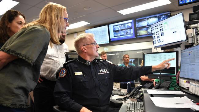 Joint Emergency Services Communication Centre Dispatch Sergeant Wolfgang Langeneck shows NT coroner Elisabeth Armitage how the triple-0 calls are taken by JESCC and dispatched to police.