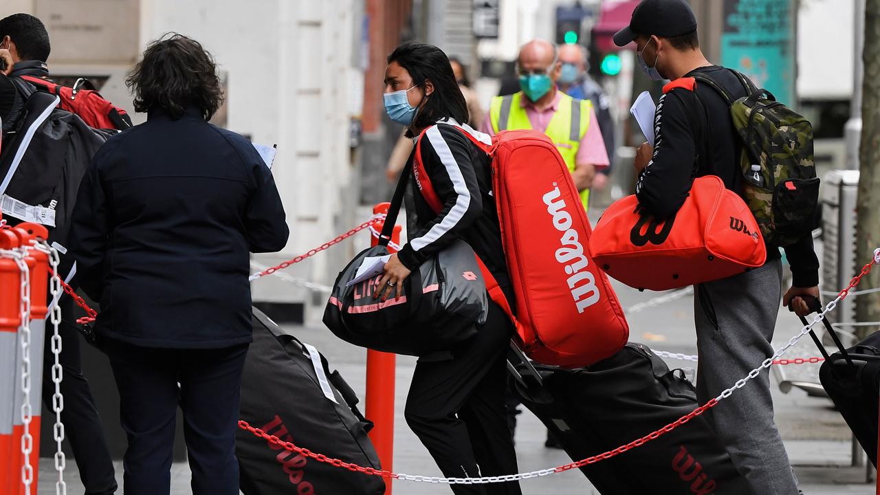 Tennis players, coaches and officials arrive at a hotel in Melbourne