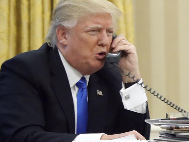 President Donald Trump speaks on the phone with Australian Prime Minister Malcolm Turnbull in January. Transcripts of the conversations with the leaders of Mexico and Australia have been leaked. Picture: AP