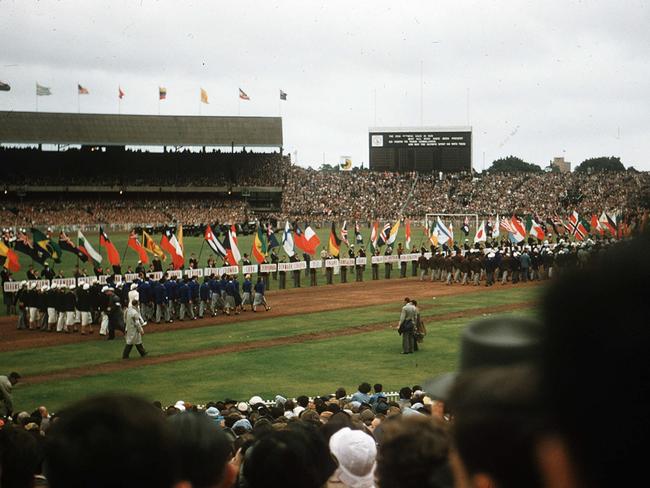 Athletes march on to the MCG. Picture: Albert Fowler