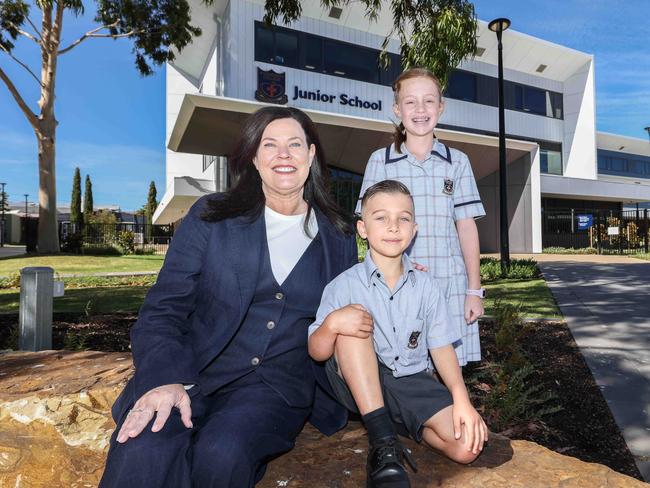 NEWS ADVWoodcroft College principal Shannon Warren with students Phoenix Cutajar 6yr and Jana Nel 9Woodcroft College opened a new junior campus 12 months ago to address overcrowding issues. -Image/Russell Millard Photography