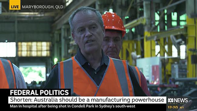 Blue man group: Bill Shorten and company, bathed in light. Picture: ABC News 24