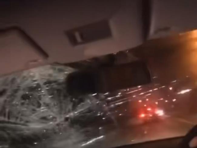 A screen grab from the video showing the damage done to the windscreen of the car.