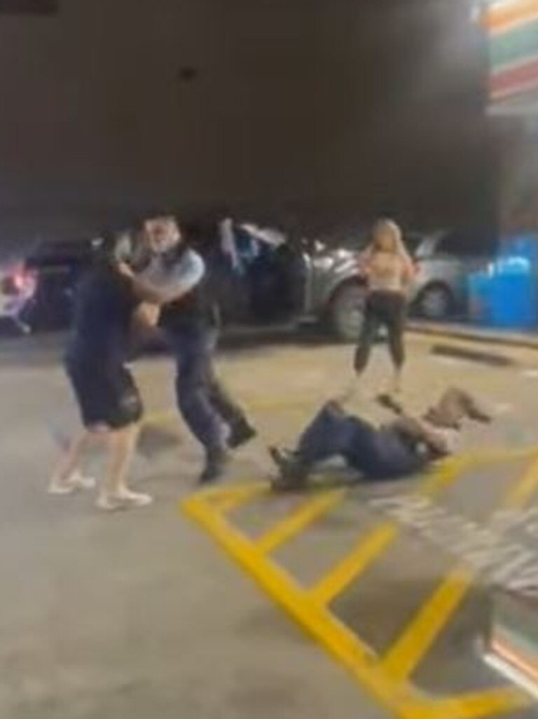She is then knocked down onto the ground. Picture: Only in Guildford/Facebook