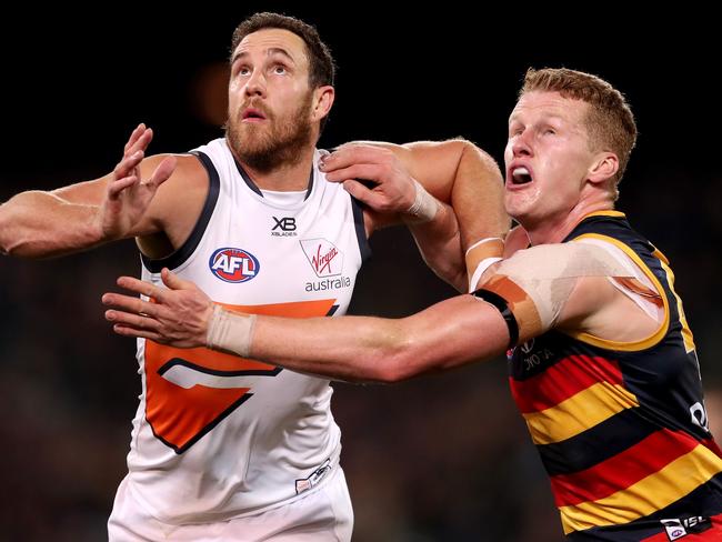 Reilly O’Brien has been loving challenging himself against some of the best rucks in the AFL, including GWS’s Shane Mumford. Picture: James Elsby/AFL Photos/Getty Images