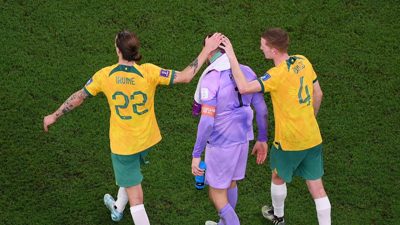 Jackson Irvine, Mathew Ryan and Kye Rowles of Australia react