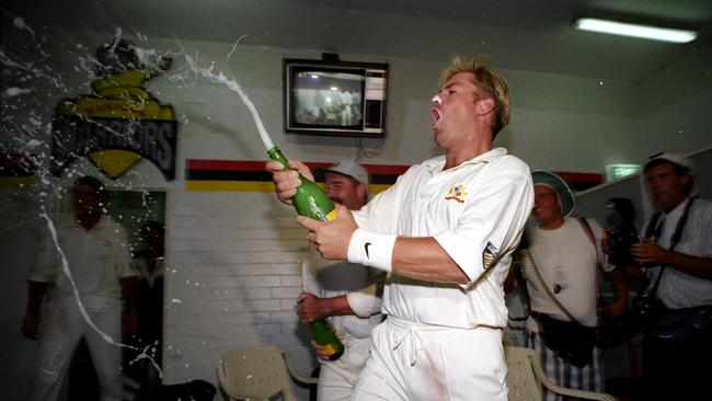 Who is thirsty? Spin king Shane Warne celebrates winning the fifth Ashes Test in 1995, in Perth. Picture Mike Keating