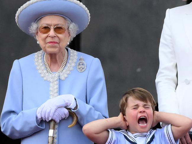 Prince Louis holds his ears during the special flypast. Picture: AFP