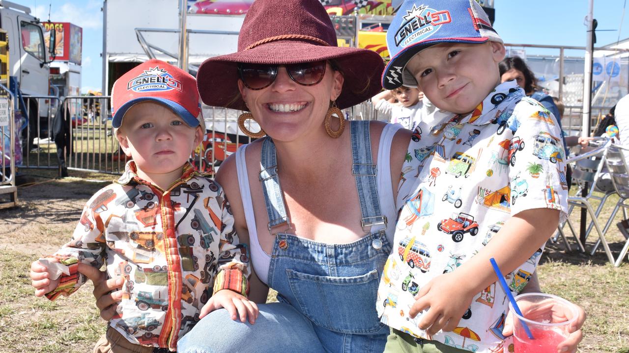 Theo, Nikki, and Hugh Howard of Bowen enjoying a refreshing slushie on a sunny show day. Picture: Kirra Grimes