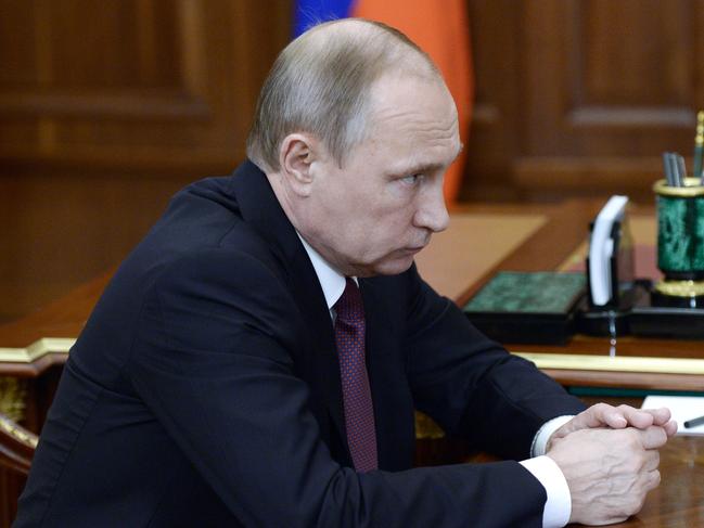 Russian President Vladimir Putin listens during a meeting in Moscow's Kremlin, Russia, on Monday, Aug.1, 2016. (Alexei Nikolsky/Sputnik, Kremlin Pool Photo via AP)