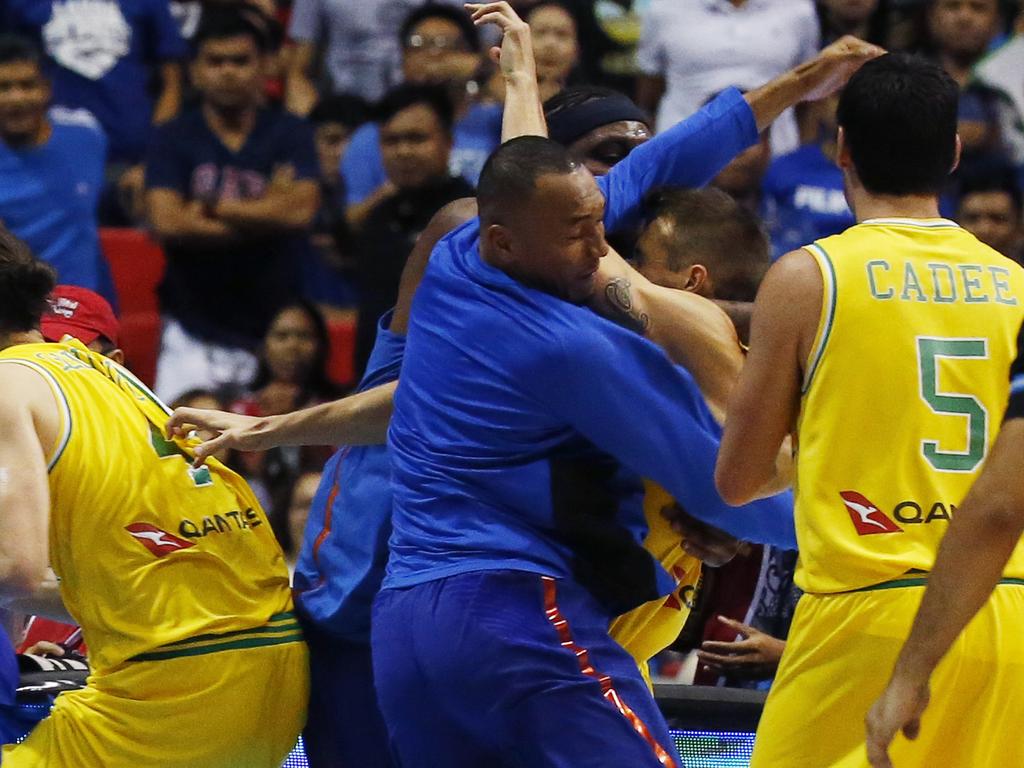 The Philippines and Australian basketball players react, during the FIBA World Cup Qualifiers Monday, July 2, 2018 at the Philippine Arena in suburban Bocaue township, Bulacan province north of Manila, Philippines. Australia defeated the Philippines 89-53 via default following a brawl in the third quarter. (AP Photo/Bullit Marquez)