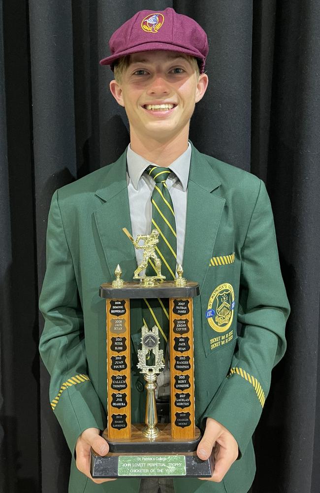 A proud as punch Steve Hogan with an award from St Patrick's College last week.