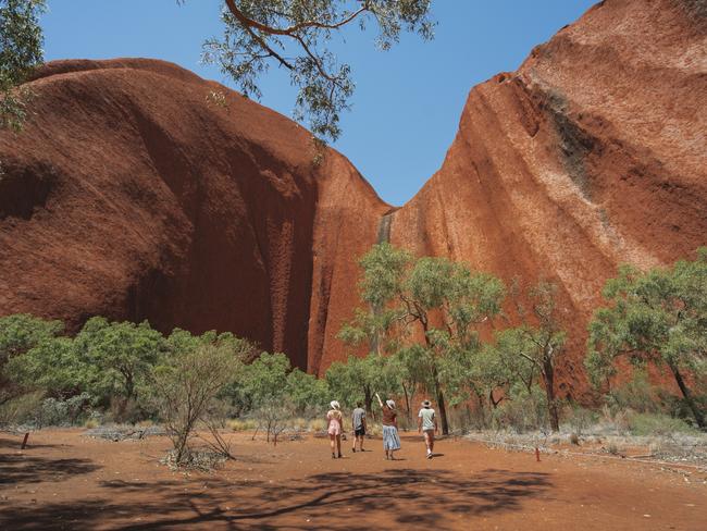 ESCAPE.  Made of sandstone, Uluru is often referred to as the heart of the Red Centre. Exploring around the base of Uluru. Must credit: Tourism NT/Salty Aura