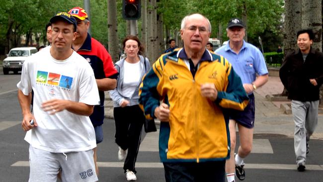 Former prime minister John Howard during an early morning run in Beijing, China.