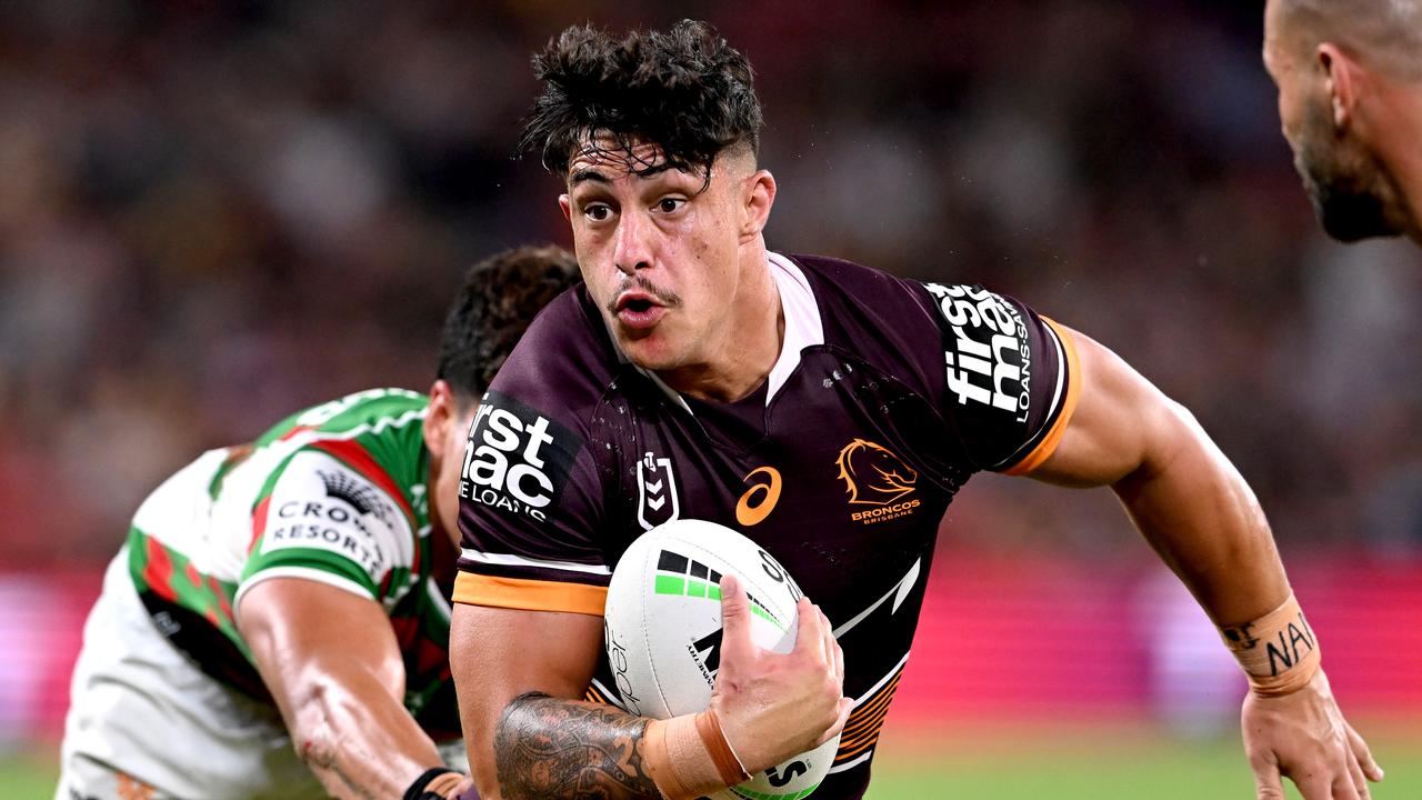 BRISBANE, AUSTRALIA - MARCH 11: Kotoni Staggs of the Broncos takes on the defence during the round one NRL match between the Brisbane Broncos and the South Sydney Rabbitohs at Suncorp Stadium, on March 11, 2022, in Brisbane, Australia. (Photo by Bradley Kanaris/Getty Images)