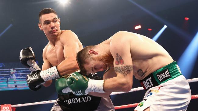 Tim Tszyu punches Dennis Hogan during the fight. Picture: Cameron Spencer/Getty Images