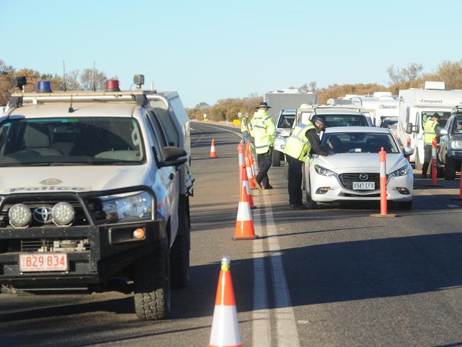 Police check motorists from South Australia heading to Northern Territory as the border opens without 14 days quarantine on 17 July 2020 . Picture: Michael Marschall