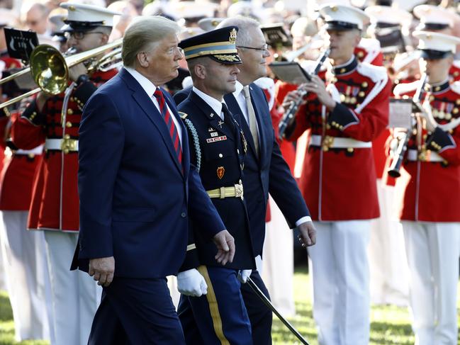 US President Donald Trump and Australian Prime Minister Scott Morrison review troops during a State Arrival Ceremony on the South Lawn of the White House. Picture: AP