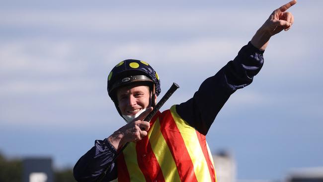 Jockey James McDonald reacts after riding winning horse Nature Strip at the Everest. Picture: AFP