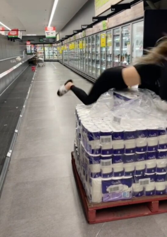 The clip shows a woman launching herself onto much-needed stock. Picture: TikTok