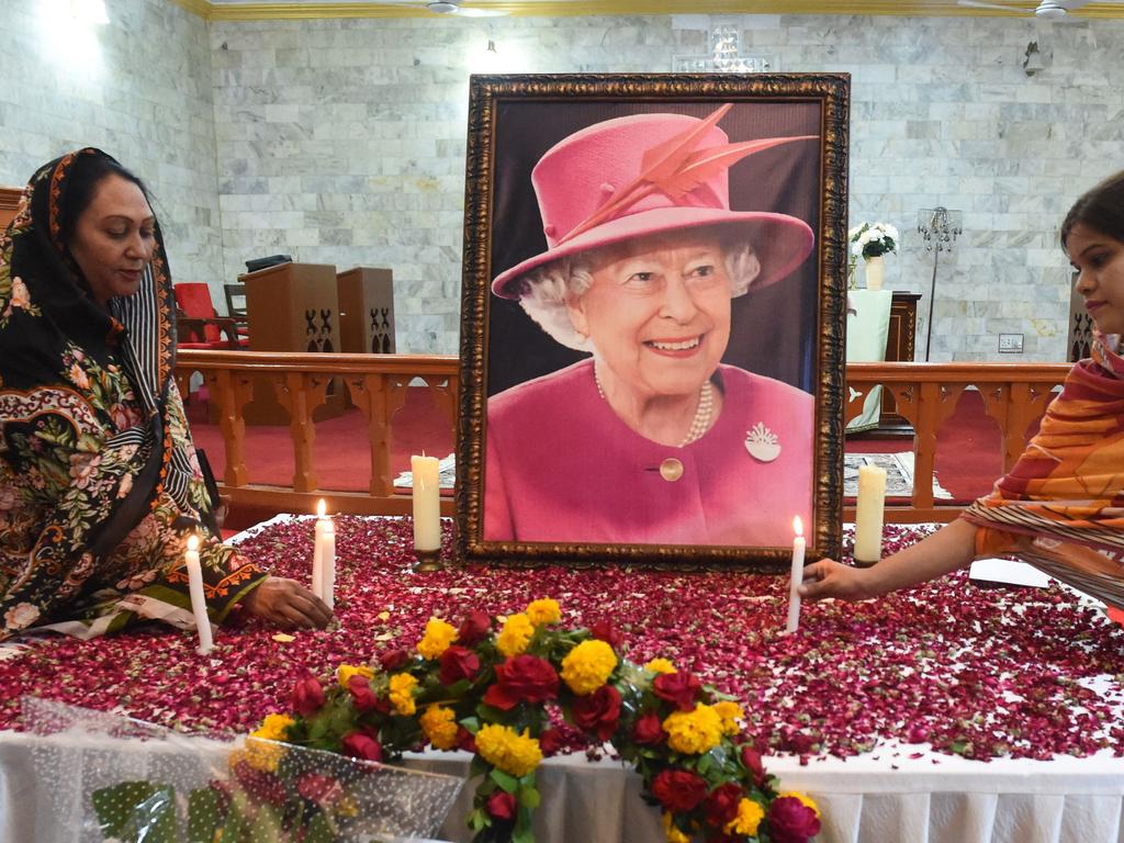 Christians light candles to pay tribute to Queen Elizabeth II at a church in Quetta. Picture: Banaras Khan/AFP