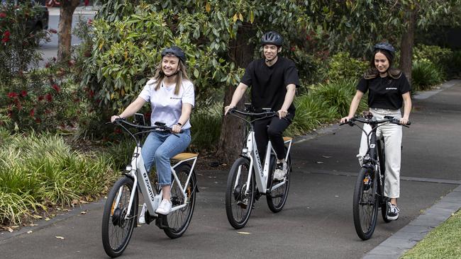 Holly Ledlin, Michaela Piggott and Jeremy Gallegos ride Zoomo bikes. Picture: John Feder/The Australian