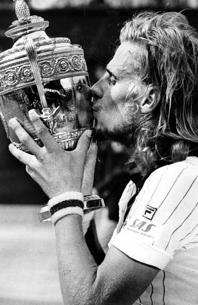 Champion Bjorn Borg kisses trophy after winning Wimbledon Men's Singles Championship final in London, 03/07/76.