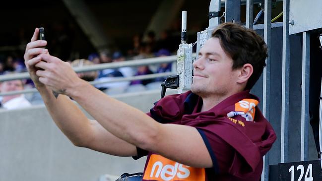 Lachie Neale takes a selfie with Fremantle fans prior to the Round 10 clash with the Dockers. Picture: Will Russell/Getty Images.