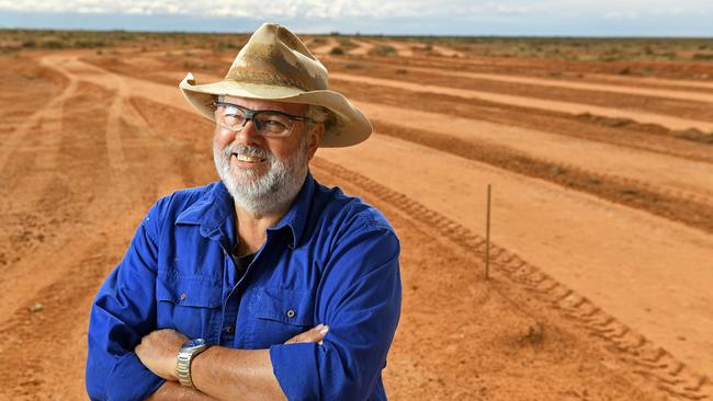 Marree Hotel owner Phil Turner in 2016 at the site of the Marree Man, where he helped restore the artwork. Picture: Tom Huntley