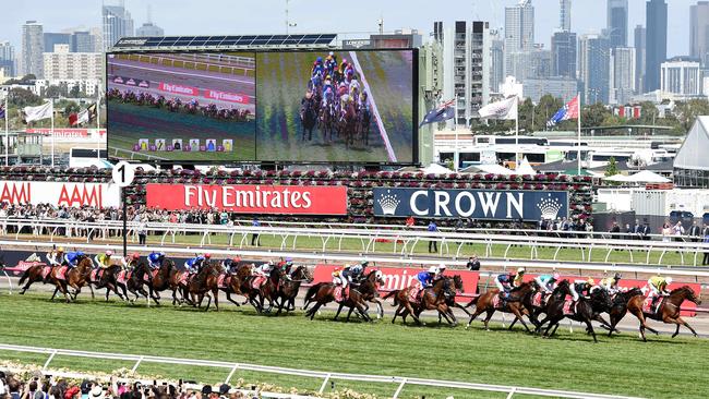 The field makes its way down the straight at the start of the 2015 Melbourne Cup. Picture: Nicole Garmston