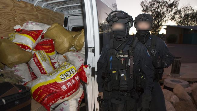 Australian Federal Police with the van carrying bags allegedly full of methamphetamine.