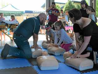 AMBO OPEN DAY: Paramedic Anthony Downes guides an interactive CPR session on September 15. Picture: Amani Vassiliou