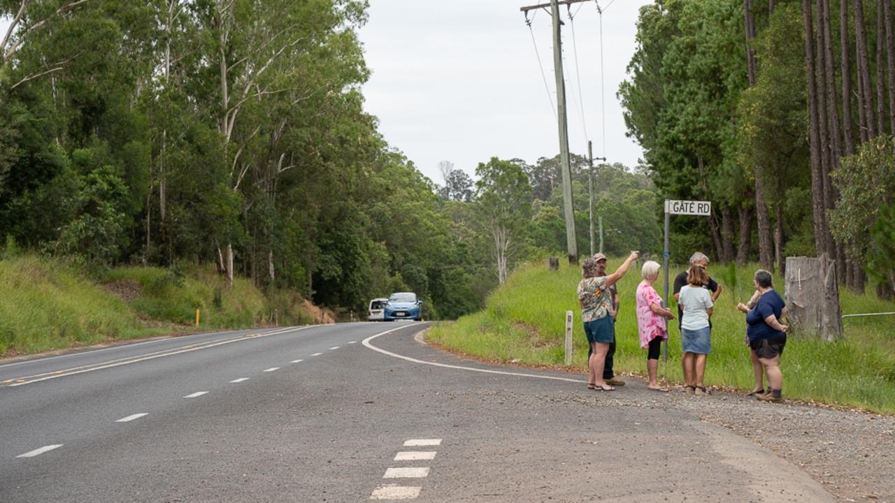 Canina residents congregate at the intersection of Gate Rd and Tin Can Bay Road to express their ongoing concerns about the 10km stretch between Kin Kin Rd and Wilson’s Pocket Rd.