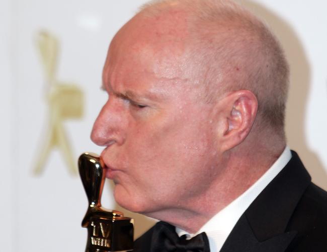 Ray Meagher (Home and Away’s Alf Stewart) kisses his Gold Logie win in 2010.