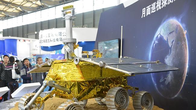 A nuclear explosion rises above Europe in the top right of the above picture which shows a model of a lunar rover known as The Yutu, or Jade Rabbit on display at the China International Industry Fair 2013. AFP /Peter PARKS