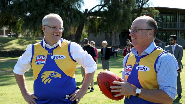 Prime Minister Scott Morrison (left) and Steve Irons, MP for Swan are seen during a visit to Clontarf Aboriginal College in Perth on Tuesday, October 2, 2018. (AAP Image/Richard Wainwright) NO ARCHIVING