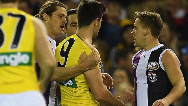 Trent Cotchin and Jack Lonie remonstrate after the Tiger’s gut punch on the Saint. Picture: AAP