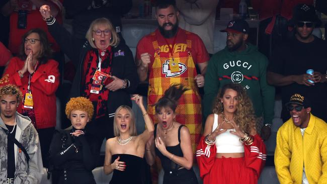 From far left, RIOTUSA and Ice Spice, Ashley Avignone, the one and only Taylor Swift, Blake Lively and Kelce’s best friend Aric Jones. In the row above them is Kelce’s mum Donna and brother Jason. Picture: Rob Carr/Getty Images