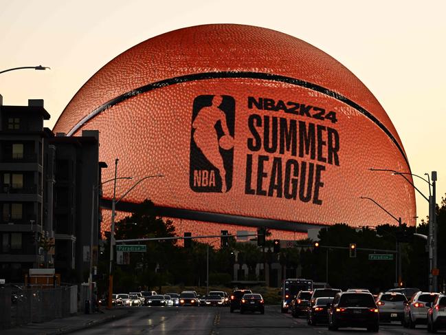 TOPSHOT - The MSG (Madison Square Garden) Sphere, new music entertainment arena, is lit up as a basketball to celebrate the 2023 NBA Summer League in Las Vegas, Nevada, on July 9, 2023. (Photo by Patrick T. Fallon / AFP)