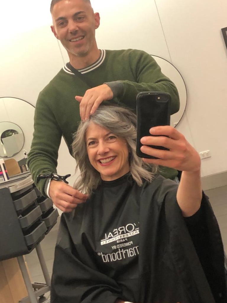 Professor Nicola Spurrier getting her haircut, at The Pose Unley, Malvern, with her hairdresser Forch Macheda. Picture: Supplied.