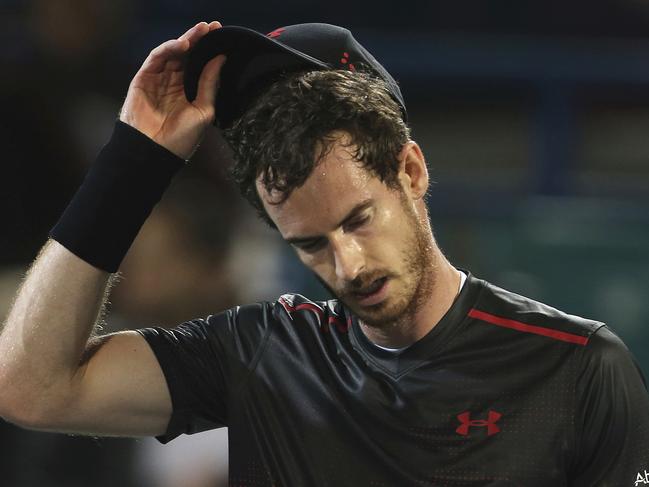 FILE - In this Friday, Dec. 29, 2017, file photo, Great Britain's Andy Murray reacts after he lost a match to Spain's Roberto Bautista Agut during the second day of the Mubadala World Tennis Championship in Abu Dhabi, United Arab Emirates. Murray has withdrawn from the Brisbane International because of a problem with his right hip. The former No. 1-ranked Murray had been scheduled to play his first match on Thursday, but notified organizers he was pulling out after failing to practice on Tuesday. (AP Photo/Kamran Jebreili, File)