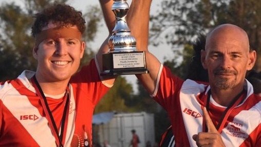 Colts A-grade captain Lachlan Jones and Alistar Hirst hoist the Rugby Capricornia A-grade men's premiership trophy.