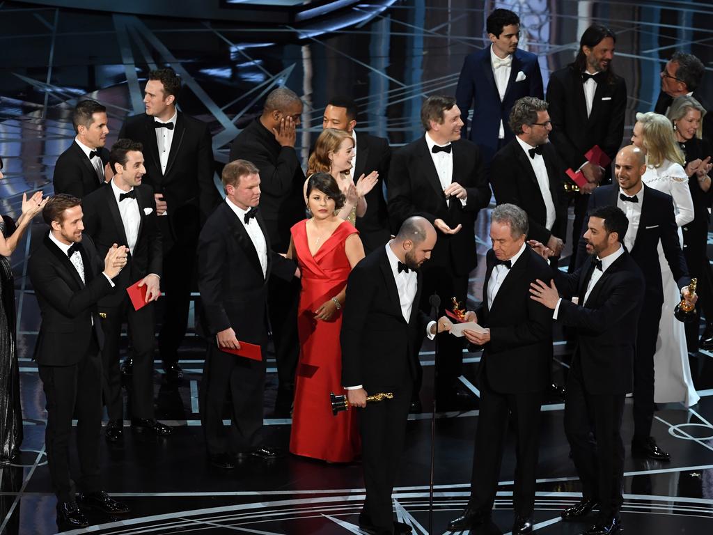 ‘La La Land’ producer Jordan Horowitz grabs the winner card reading actual Best Picture winner ‘Moonlight’ with actor Warren Beatty and host Jimmy Kimmel onstage during the 89th Annual Academy Awards. Picture: Getty