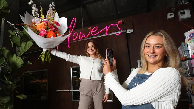 Geelong Flower Farm social media lead Paige Beekmans (left) and manager Rebecca Dickson. Picture: Alan Barber