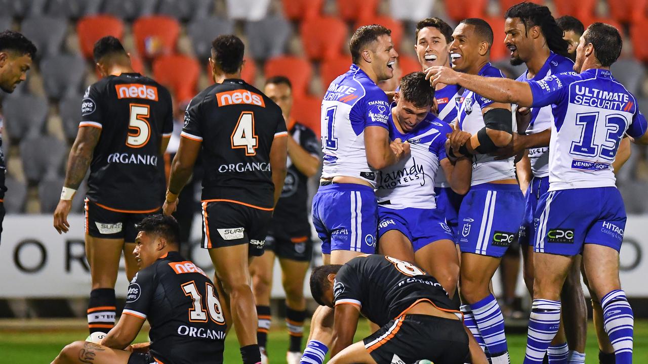 BRISBANE, AUSTRALIA - SEPTEMBER 05: Jake Averillo of the Bulldogs celebrates with teammates after scoring a try during the round 25 NRL match between the Wests Tigers and the Canterbury Bulldogs at Moreton Daily Stadium, on September 05, 2021, in Brisbane, Australia. (Photo by Albert Perez/Getty Images)