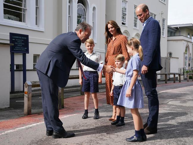 Headmaster Jonathan Perry greets the children as they arrive for a settling in afternoon at Lambrook School, near Ascot. Picture: Jonathan Brady - Pool/Getty Images